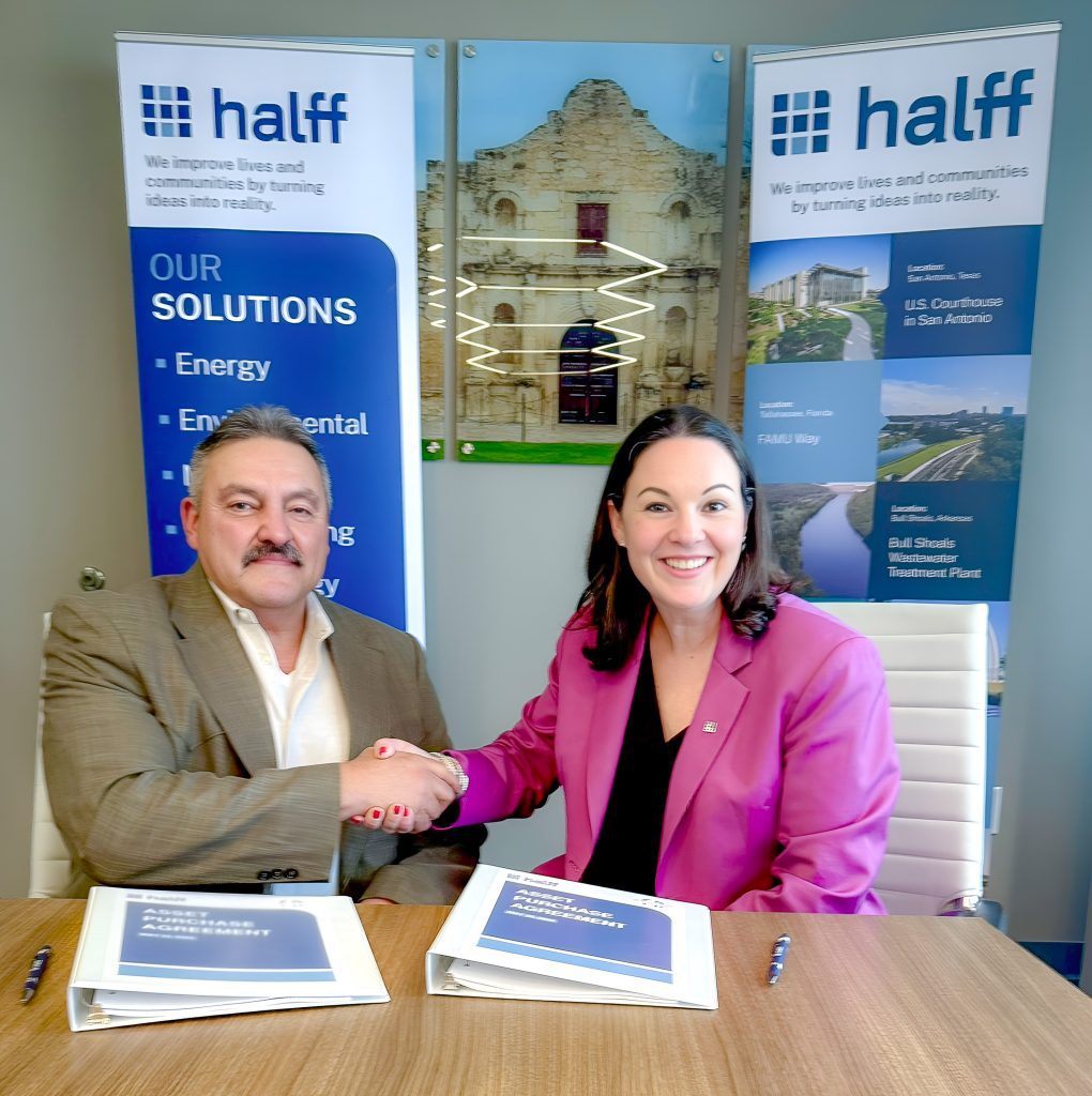 Halff's President and CEO Jessica Baker Daily signing purchase acquisition agreement with C&D Utility Consulting's Romeo Cabrera